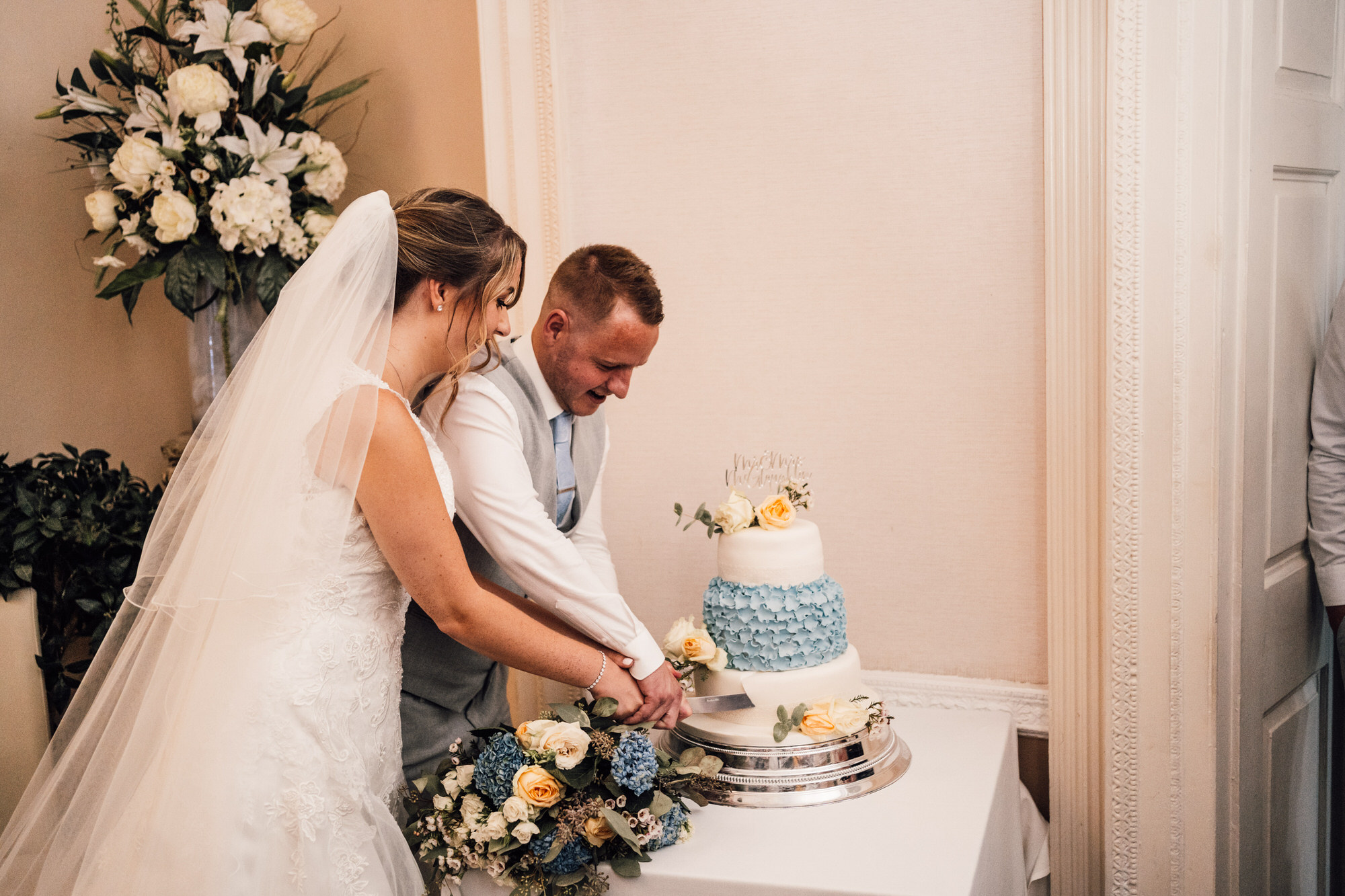 Colwick Hall Wedding Bride and Groom cake cutting
