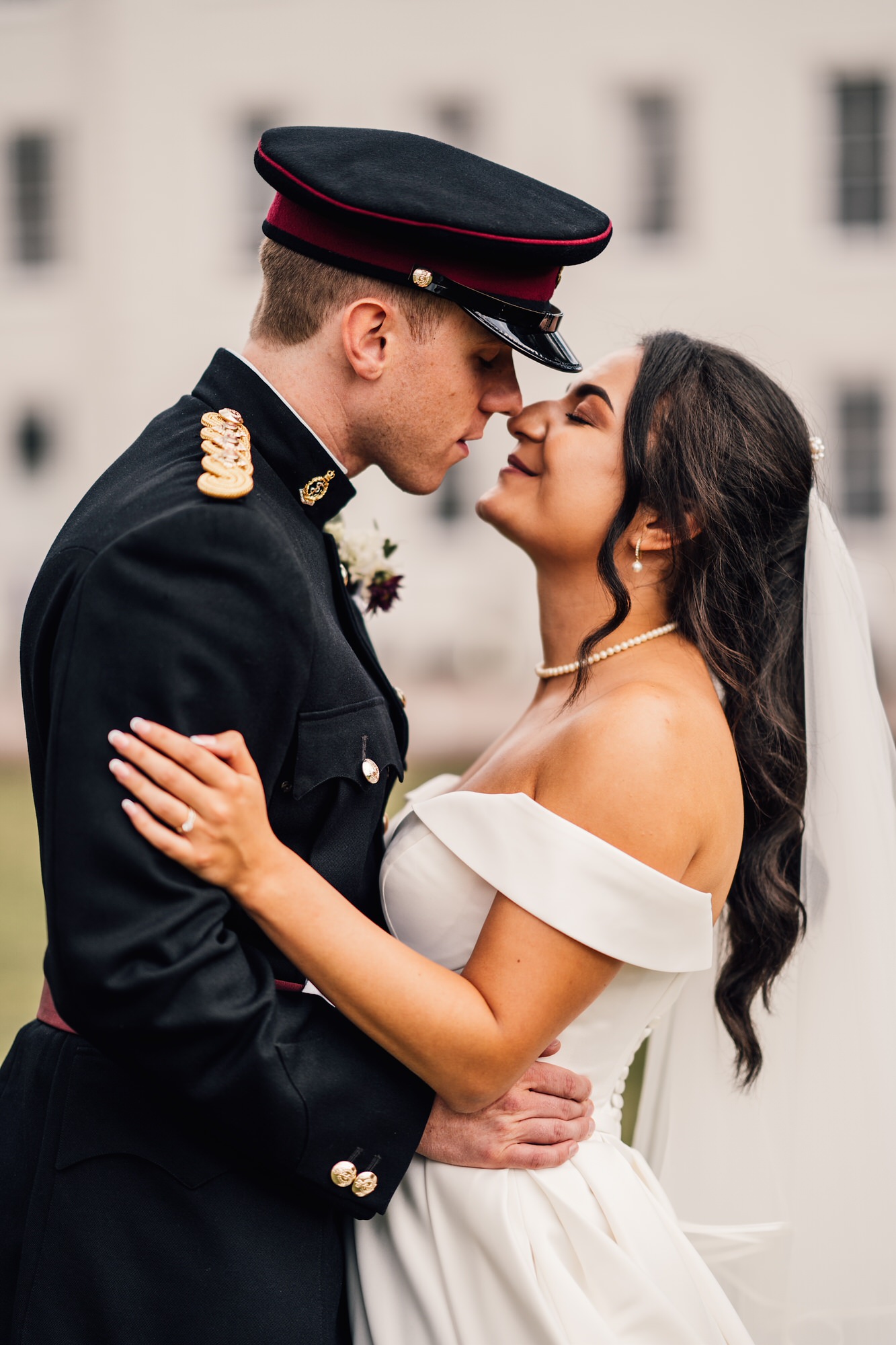 Romantic portrait of bride and groom kissing