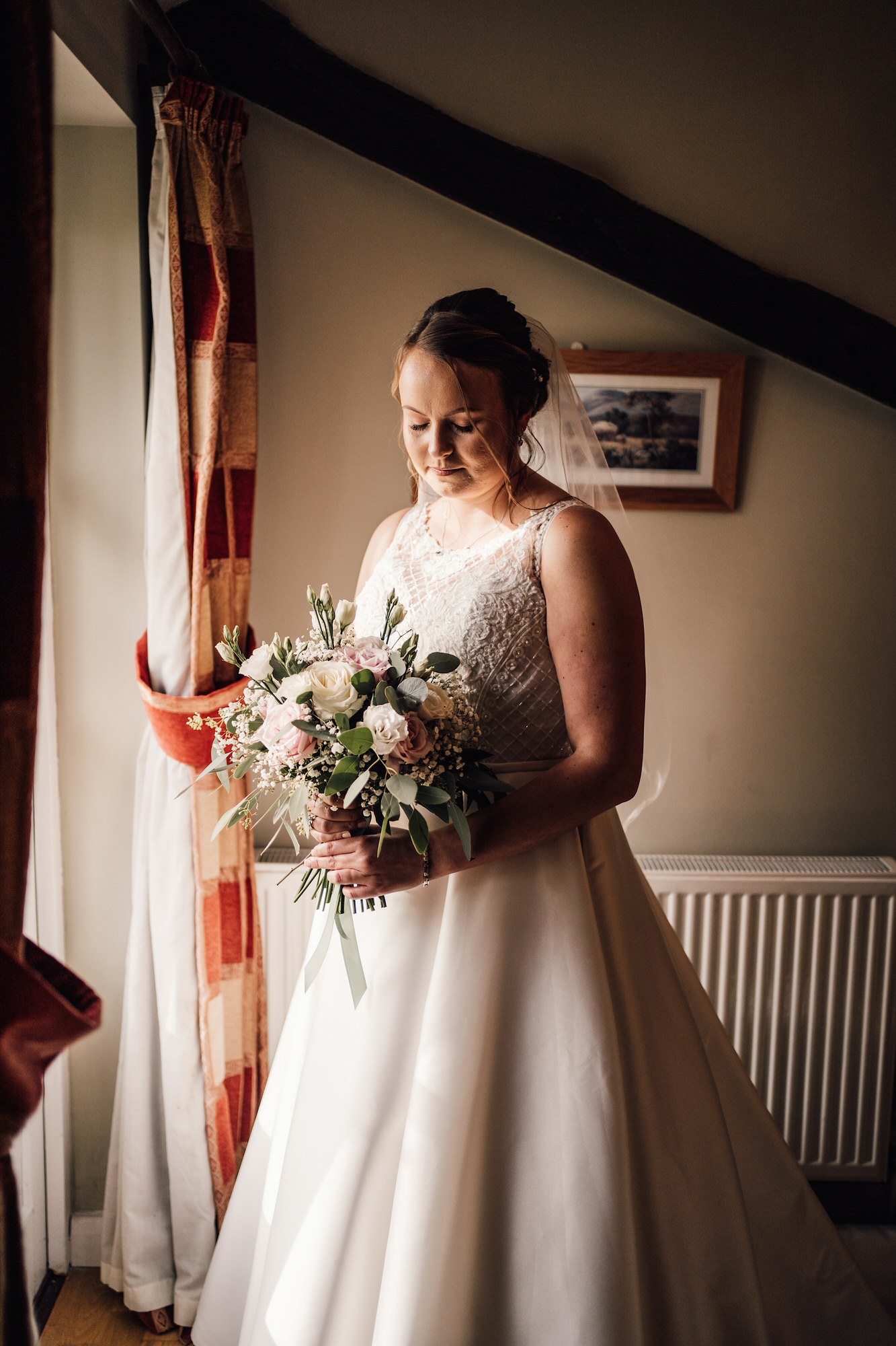 photo of bride by the window