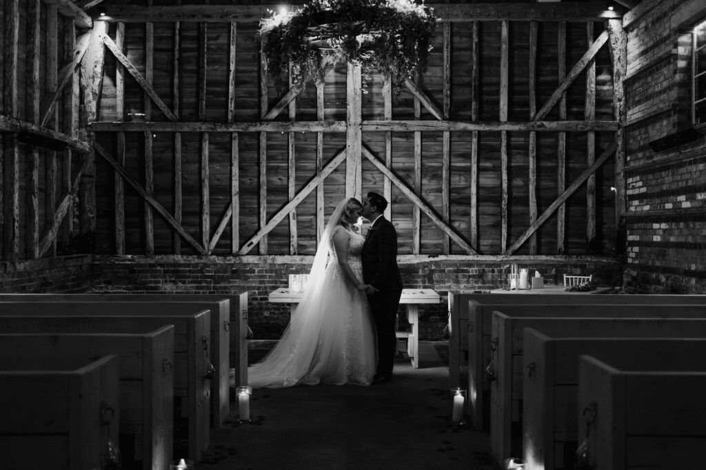 bride and groom photo inside milling barn 