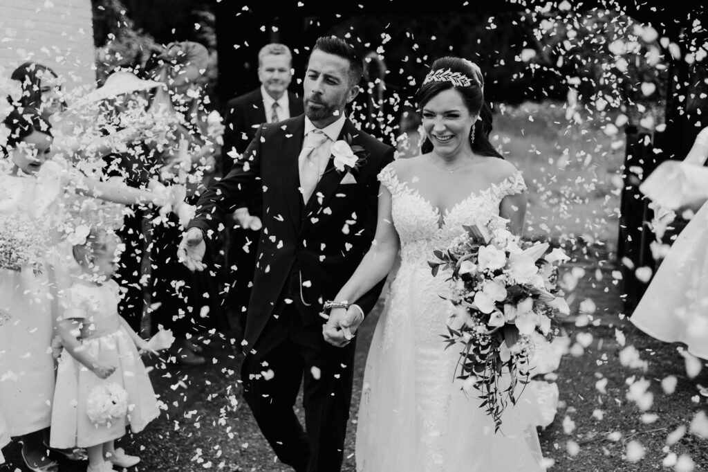 confetti toss portrait with bride and groom