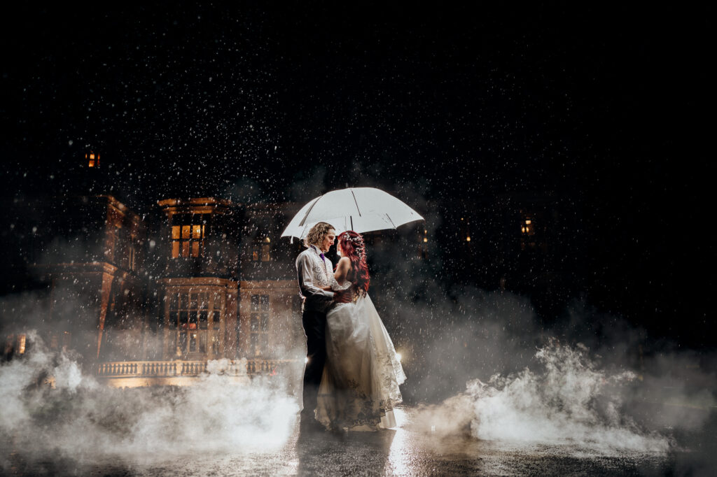 bride and groom portrait in the rain with umbrella